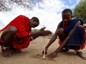 Massai making fire